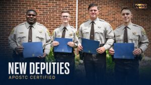 Calhoun County new deputies Xavier DeRamus, Wyatt Smith, Dalton Scott, and Koal Garrett display their academy certificates Caption: Four new Calhoun County deputies e
