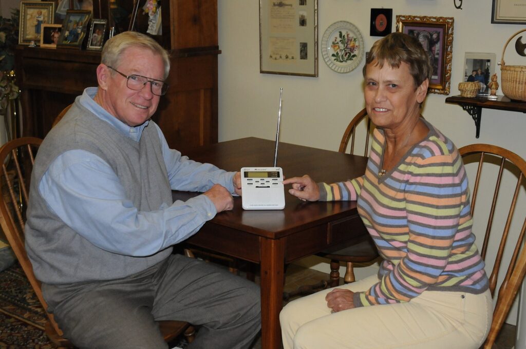 Kentucky couple holding the NOAA Weather Radio that warned them of an approaching storm.