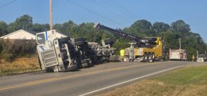 18-wheeler overturned on U.S. 411 in Moshat as recovery crews work at the scene