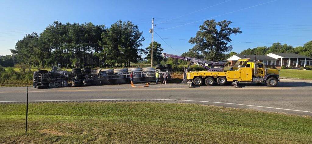 18-wheeler overturned on U.S. 411 in Moshat as recovery crews work at the scene