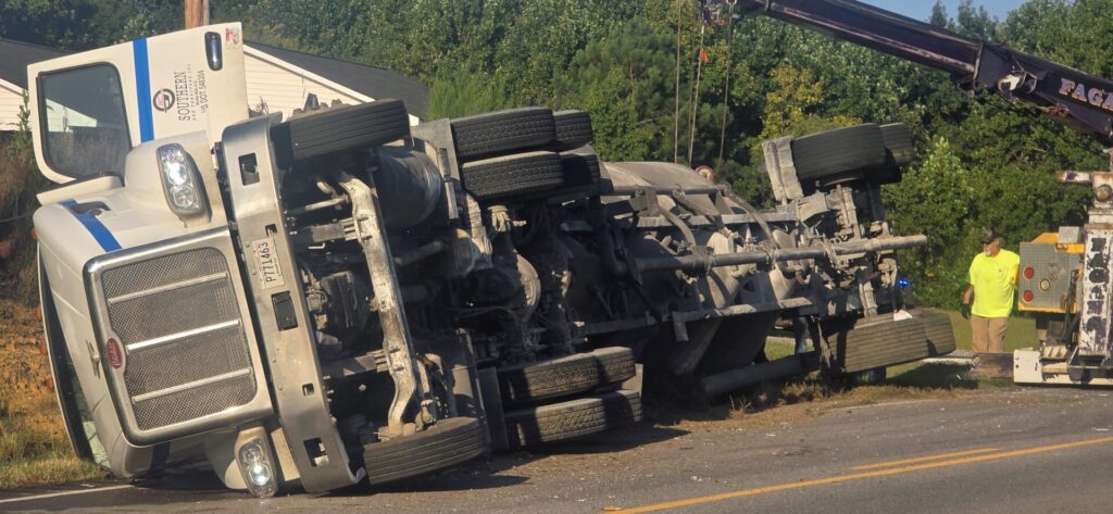 18-wheeler overturned on U.S. 411 in Moshat as recovery crews work at the scene