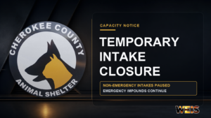 Cherokee County Animal Shelter logo beside a temporary intake closure notice stating non-emergency intakes are paused while emergency impounds continue, with subtle WEIS branding