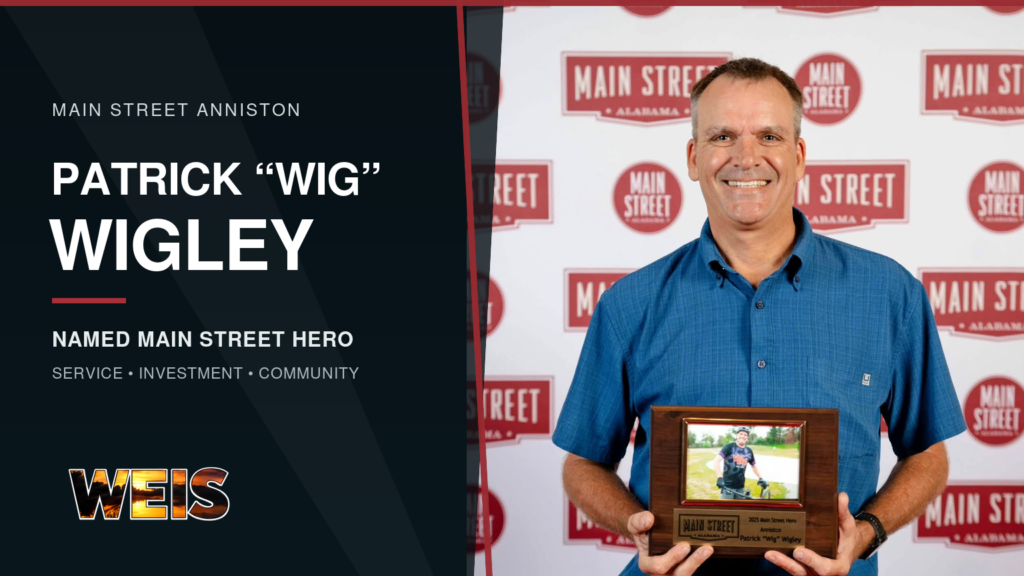 Patrick Wigley holds his Main Street Hero award in a WEIS news graphic for Main Street Anniston.
