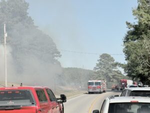 Firefighters respond to grass and brush fires along U.S. Highway 411 in Cherokee County.