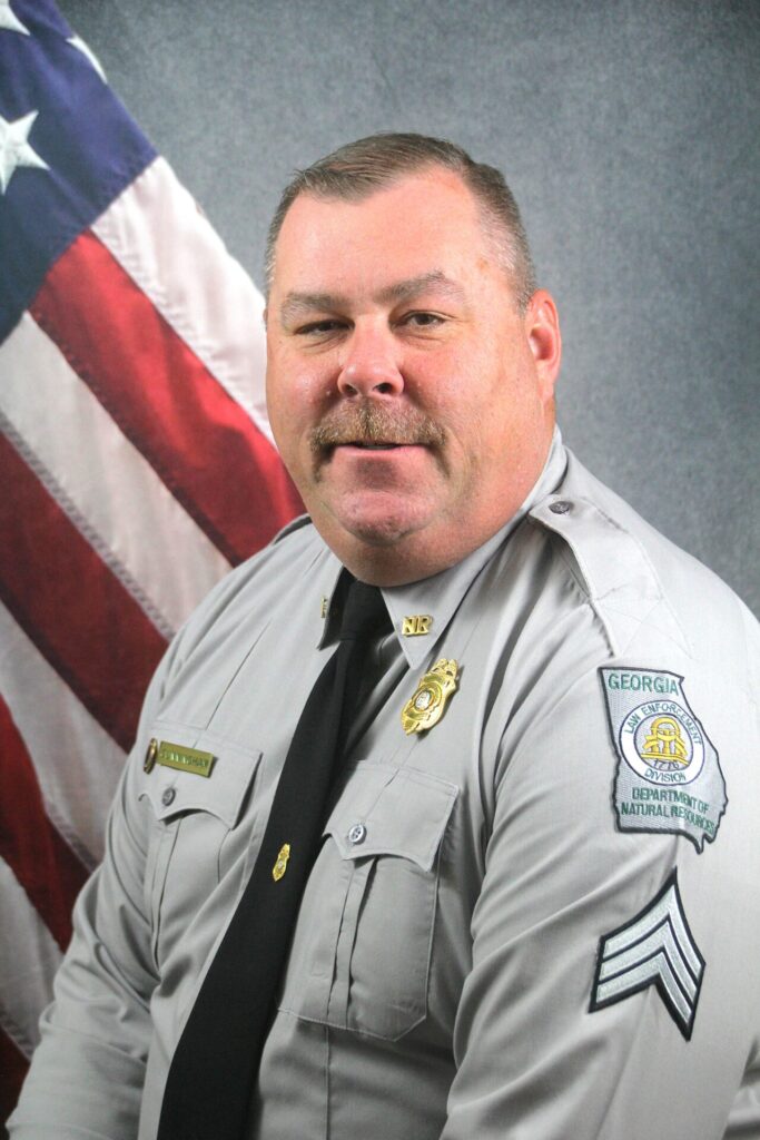 Ben Cunningham in Georgia DNR uniform beside an American flag, with his name and 27 years of service on a WEIS header.
