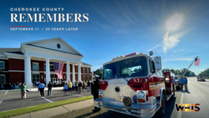 Cherokee County 9/11 remembrance at the courthouse with a vintage FDNY memorial fire engine and American flags.