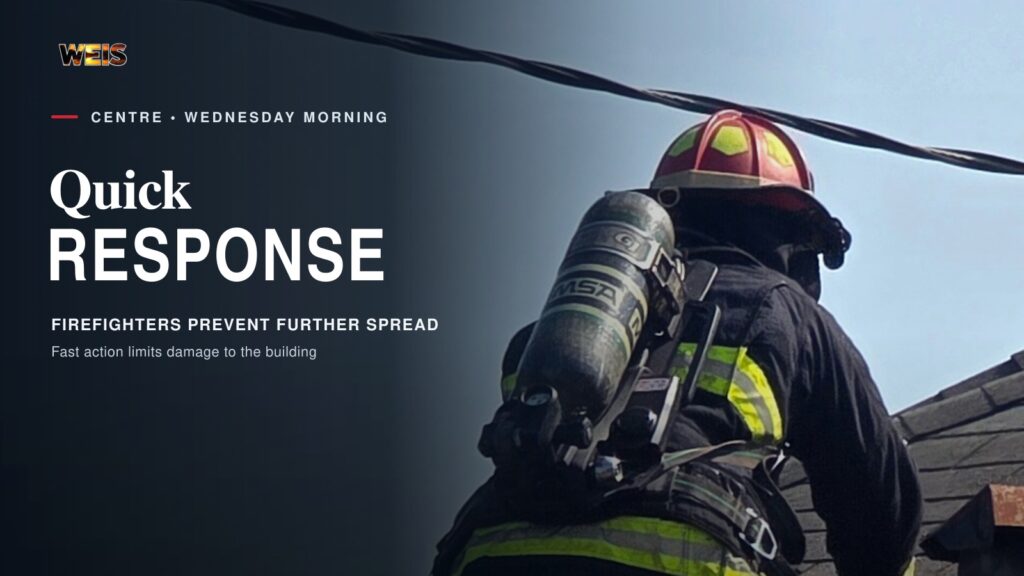 A firefighter works from a ladder on the roof during the quick response to the Fuel City fire in Centre.