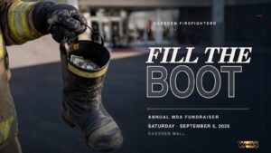 Gadsden firefighter holding a donation boot for the Sept. 5 MDA Fill the Boot drive at Gadsden Mall.
