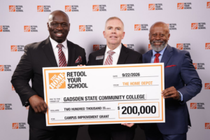 Ricky Tillis, Alan Smith, and Tony Smith hold a $200,000 Retool Your School grant check for Gadsden State.