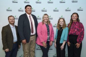 Alabama Farmers Federation official Hunter McBrayer stands with discussion meet finalists Jackson Cleary, Lydia East, Mackenzie Smith, and Belle Sansom.