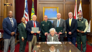 Gov. Kay Ivey and state and federal officials at the Alabama forest stewardship agreement signing.