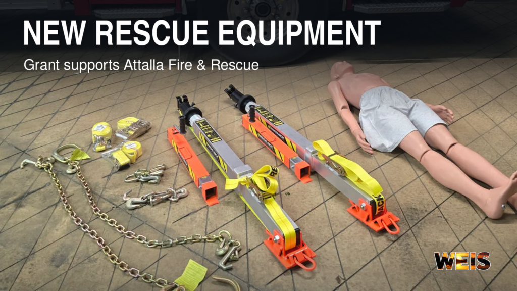 Attalla Fire stabilization struts, straps, and chains beside a training mannequin, with an equipment headline and WEIS branding.