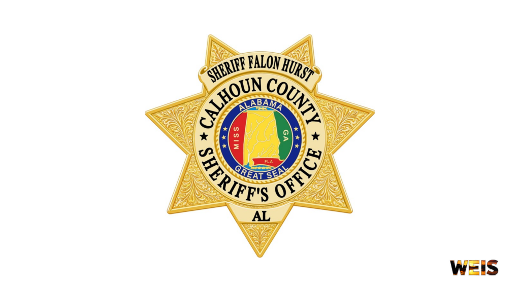 Calhoun County Sheriff’s Office gold star badge with the Alabama state seal, accompanying the Green’s Store burglary report.