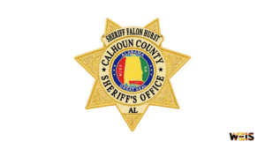 Calhoun County Sheriff’s Office gold star badge with the Alabama state seal, accompanying the Green’s Store burglary report.