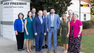 Gadsden State group portrait with Jay Freeman task force headline and WEIS branding.