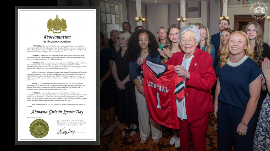 Governor Kay Ivey holds a red Central jersey with athletes beside the Alabama Girls in Sports Day proclamation.