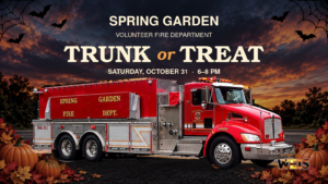 Spring Garden Trunk or Treat header featuring the flyer’s red fire truck, sunset sky, pumpkins, bats, and Oct. 31 event details.