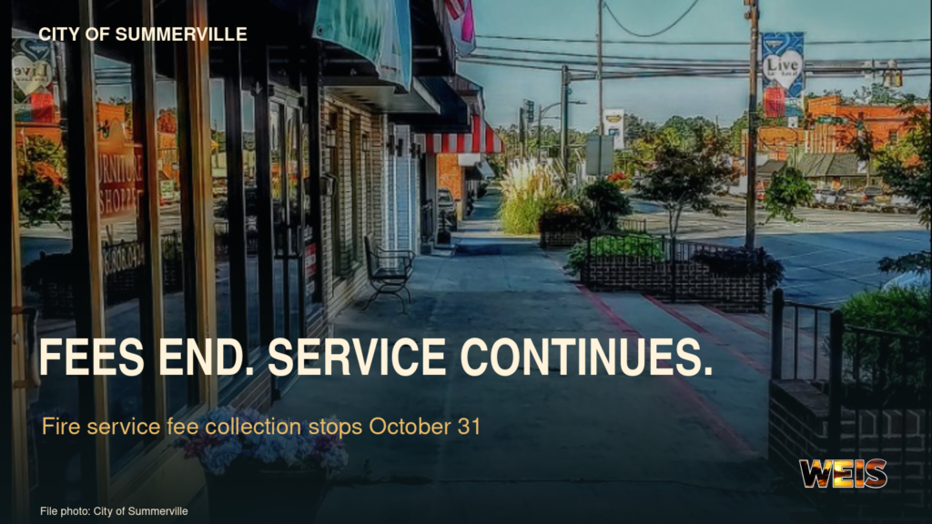 Downtown Summerville street in a news header announcing that fire service fees end October 31 while fire protection continues.